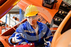 Industrial engineer foreman with hard working at industrial plant