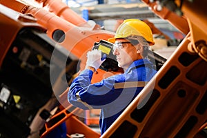 Industrial engineer foreman with hard working at industrial plant