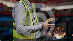 Industrial engineer foreman with safety uniform working at factory