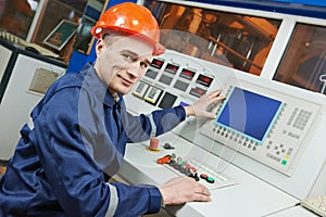 Industrial engineer worker at control panel photo