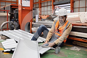 Industrial Engineer Worker Getting His Knee Injured From Metal Sheet