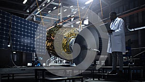 Industrial Engineer Working on Artificial Satellite Construction. Aerospace Agency: African American