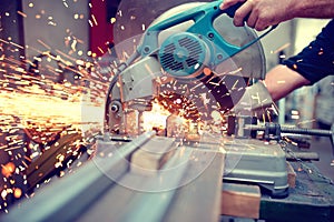 Industrial engineer working on cutting a metal and steel