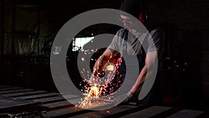 Industrial engineer working on cutting a metal and steel with compound mitre saw with sharp, circular blade