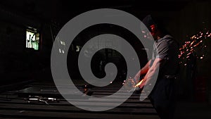 Industrial engineer working on cutting a metal and steel with compound mitre saw with sharp, circular blade