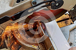 industrial engineer working on cutting a metal and steel with compound mitre saw sharp, circular blade