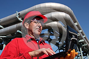 Industrial Engineer Working on a Notebook Computer Outdoor.