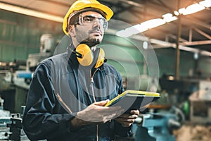 Industrial Engineers in Hard Hats.Work at the Heavy Industry Manufacturing Factory.industrial worker indoors in factory. man photo