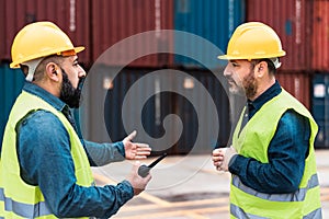 Industrial engineers working in logistic terminal of container cargo