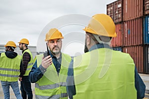 Industrial engineers working in terminal of container cargo
