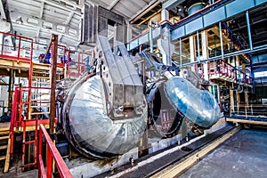 Industrial equipment at the factory in large production hall