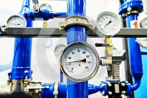 Industrial equipment of a modern boiler room. Mechanical pressure and temperature sensors installed on the pipeline. Close-up