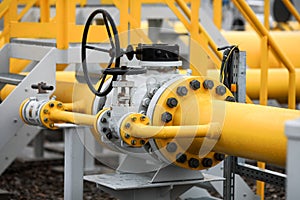 Industrial equipment pipes, manometer/pressure gauge, levers, faucets, indicators in a natural gas compressor station