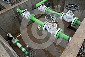 Industrial equipment pipes, manometer/pressure gauge, levers, faucets, indicators in a natural gas compressor station