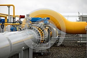 Industrial equipment pipes, manometer/pressure gauge, levers, faucets, indicators in a natural gas compressor station