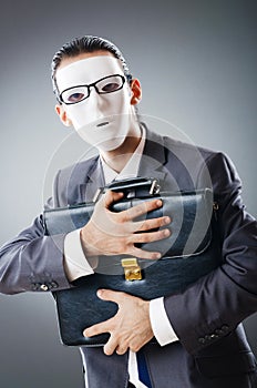 Industrial espionate concept - masked businessman