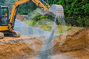 Industrial excavator for foundation building construction site, bucket details, dirt gravel