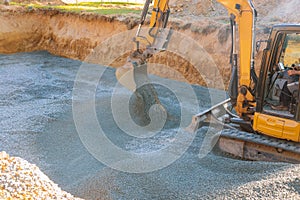 Industrial excavator for foundation building construction site, bucket details, dirt gravel