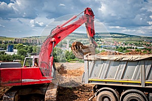 Industrial excavator loader with rised bucket photo