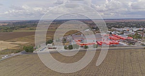 Industrial exterior of a modern factory. Modern factory top view, flying around a new modern factory in orange colors.