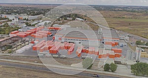 Industrial exterior of a modern factory with orange decoration. Aerial view of a large factory.