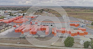Industrial exterior of a modern factory with orange decoration. Aerial view of a large factory.