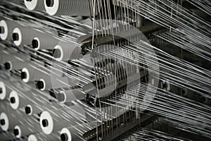 Industrial fabric production line. Weaving looms at a textile factory