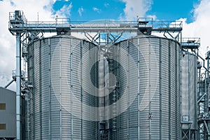 Front view of steel grain storage silos photo