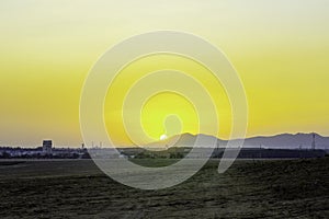 Industrial factory building with sunset sky,