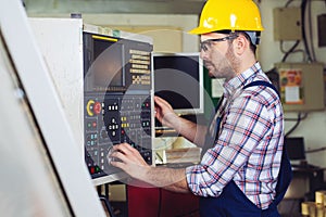 Industrial factory employee working in metal manufacturing industry