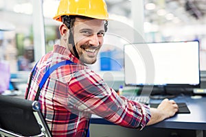 Industrial factory employee working in metal manufacturing industry