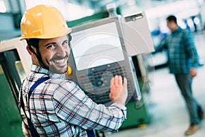 Industrial factory employee working in metal manufacturing industry