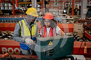 Industrial factory and manufacturing concept. Engineering with technician inspect the production of goods