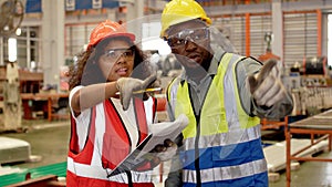 Industrial factory and manufacturing concept. Engineering with technician inspect the production of goods