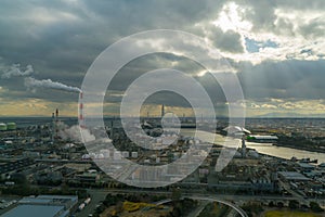 Industrial factory plant with sunlight and cloudy sky