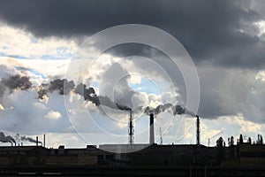 Industrial factory pollutes atmosphere and ecology harmful emissions of chemical processing