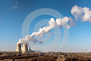 Industrial factory smoke stack of coal power plant from chimney up on sky cause air pollution and destroy the Earth`s atmosphere