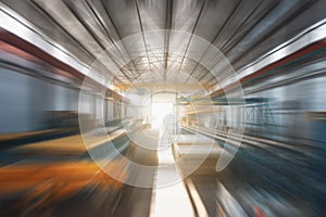 Industrial factory warehouse interior in blurred motion and sunlight affect