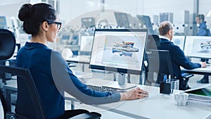 Industrial female Engineer Working on a Personal Computer, Screen Shows CAD Software wit