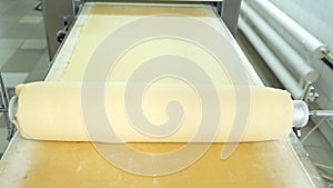 Industrial food factory or bakery.Production of confectionery products. Dough on an automatic conveyor belt, the process