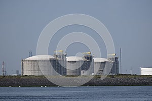 Industrial gas installation. Transshipment and Storage for LNG or liquefied natural gas in the port of Rotterdam. Ships moor for