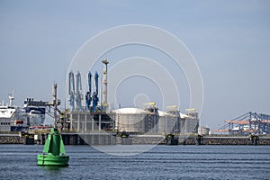 Industrial gas installation. Transshipment and Storage for LNG or liquefied natural gas in the port of Rotterdam. Ships moor for