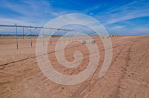 Industrial Grade Field Sprinkler in Fresh Dirt Field