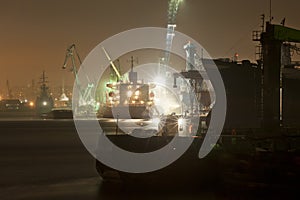 Industrial harbor night view and cargo ship