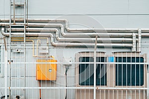 Industrial heating and cooling system with gas meter, pipes and heat pump