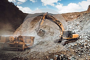 Industrial heavy duty excavator moving gravel on highway construction site