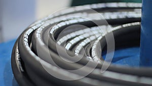 Industrial hose is wound in hank during production process. Manufacture of hoses