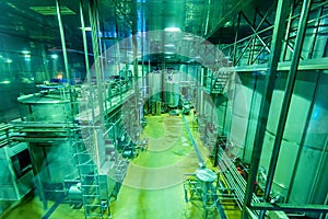 Industrial interior of soft drinks factory with tubes