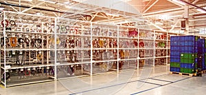 Industrial landscape with boxes and racks of wires at a modern plant for the production of electric wiring for automobiles.