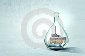Industrial landscape with chimneys inside glass bottle